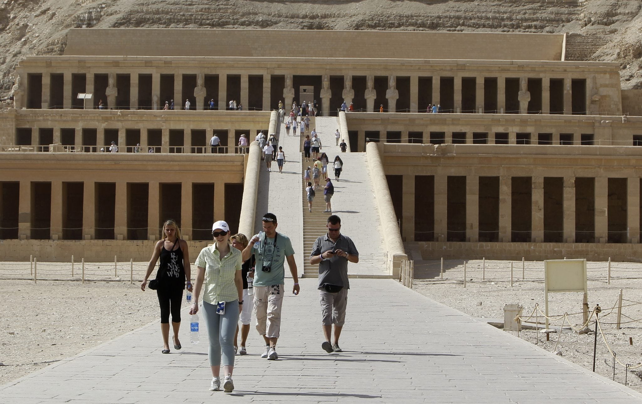Tourists walk along the main corridor of the Temple of Hatshepsut, a day after a hot air balloon crash left 19 foreigners dead, in Luxor, February 27, 2013. 