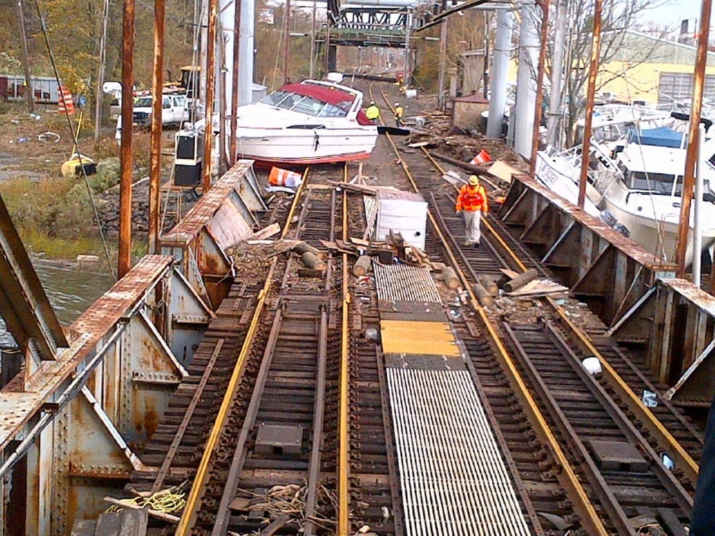 Boats, dumpsters and other debris block the North Jersey Coast Line rail track at Morgan Draw Bridge in New Jersey in the aftermath of super storm Sandy in this handout photo. 