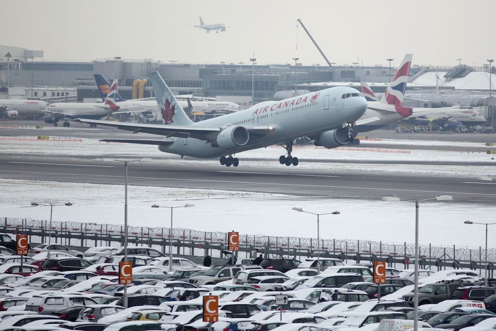 An Air Canada aircraft takes off after snowfall at Heathrow airport in London January 21, 2013. 