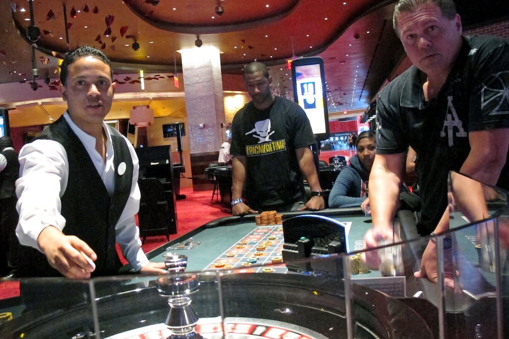 In this May 21, 2012 file photo, a dealer at Revel prepares for another round of roulette at the Atlantic City, N.J., casino as patrons await the result. 