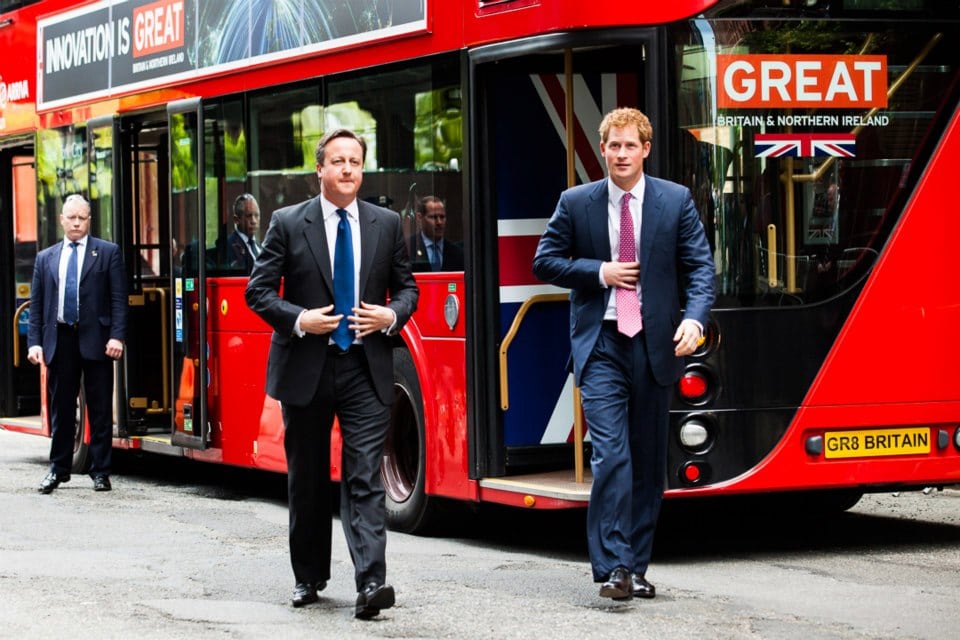 Britain's Prince Harry, right, and Prime Minister David Cameron arrive by New London Bus for the GREAT event, in New York, Tuesday, May 14, 2013.