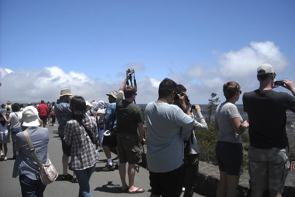 Tourists snap photos outside of the Jagger Museum in Hawaii's volcano national park. 