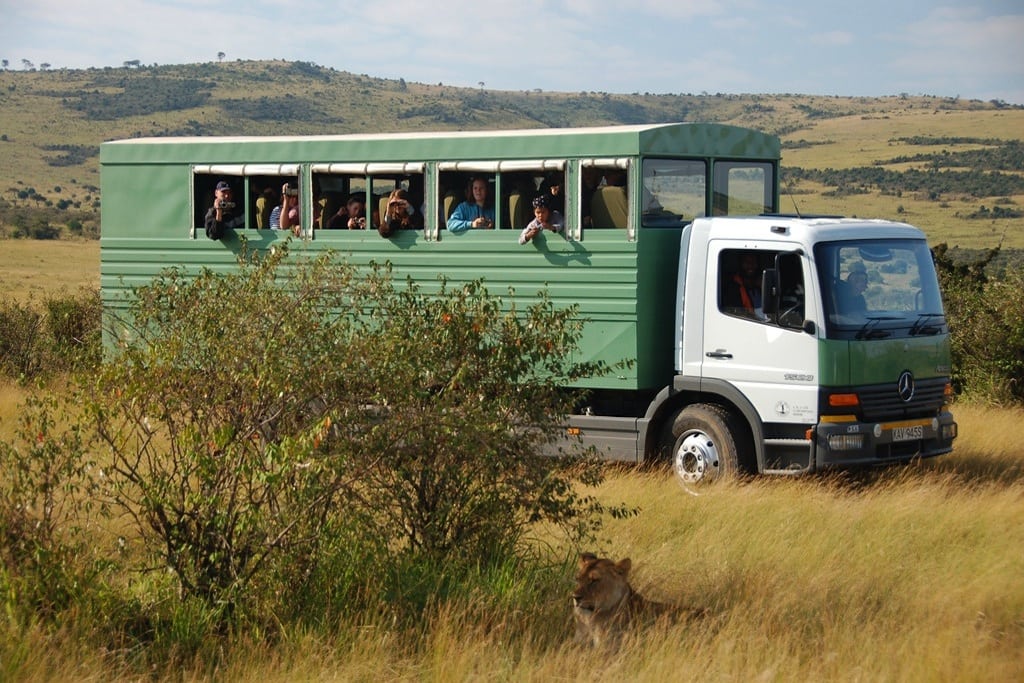 Converted garbage trucks are used to transport groups of 26 tourists around Kenya. 