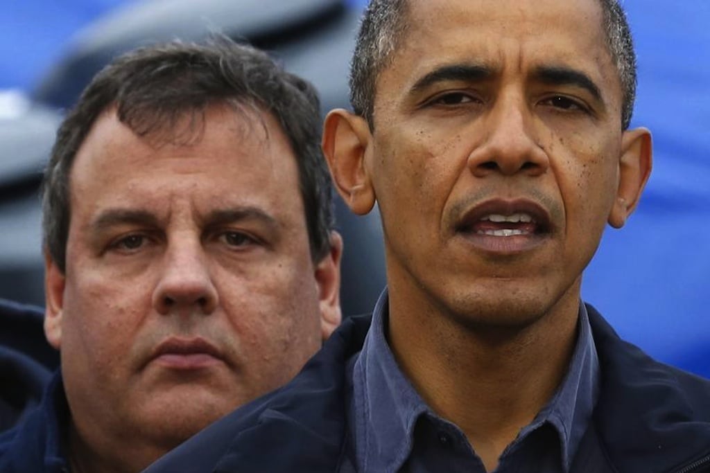 President Barack Obama speaks after a tour around the damage done by Hurricane Sandy in Brigantine, New Jersey, in this file October 31, 2012 photo. New Jersey Governor Chris Christie stands behind Obama. 