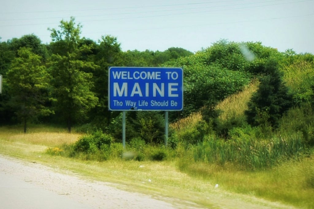 The simple sign welcoming visitors to Maine. 