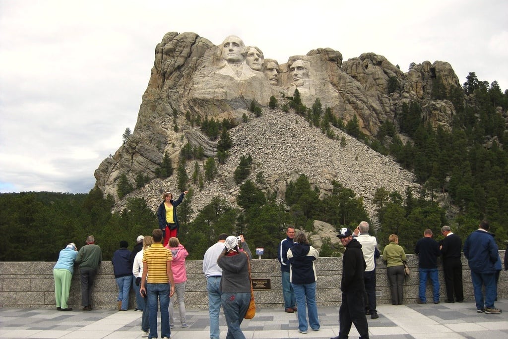 Tourists take pictures of the Mount Rushmore National Monument in South Dakota. 