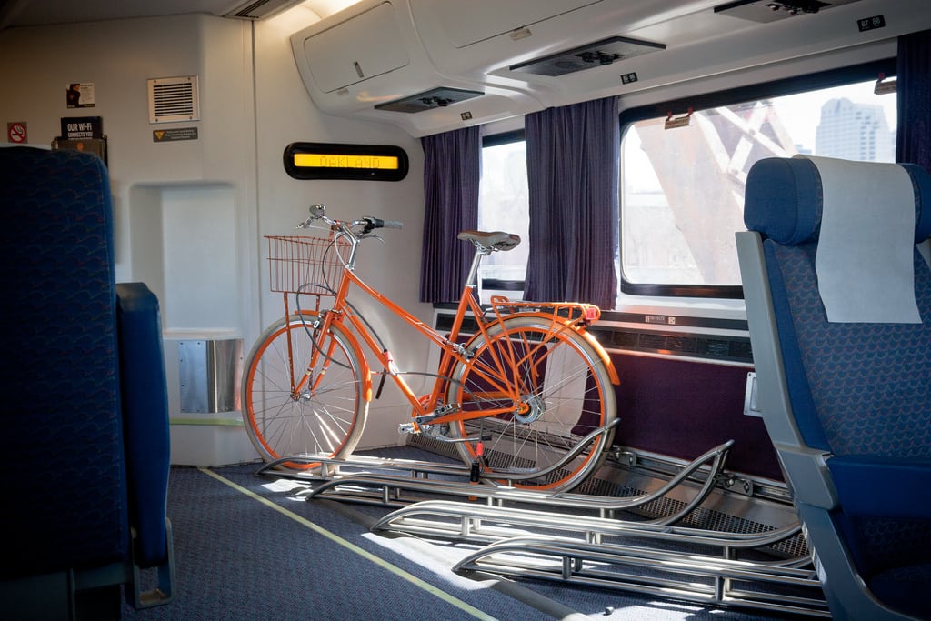 An orange bike on an Amtrak car in California. 