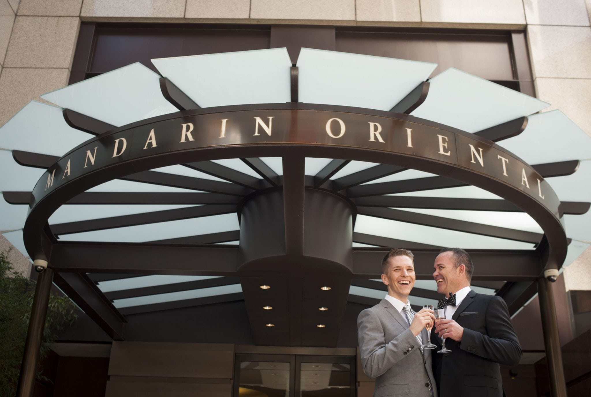 Two men celebrate their marriage outside of the Mandarin Oriental hotel in San Francisco 