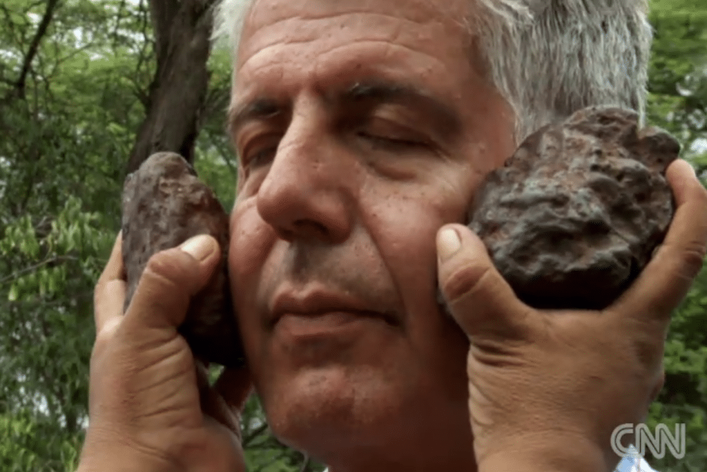 Bourdain is given a spiritual bath by a shaman. 