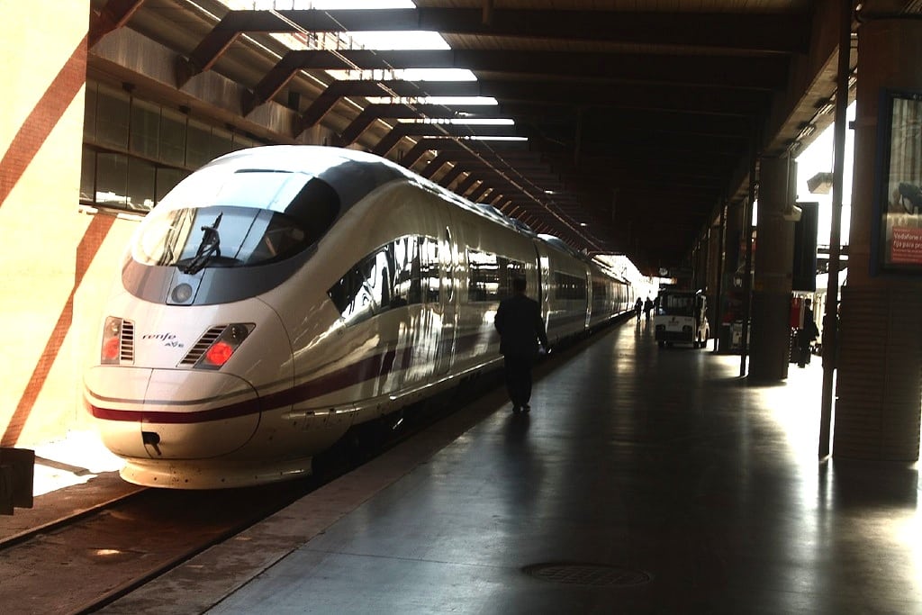 A traveler boards Spain's high-speed rail AVE Madrid Atocha station. 