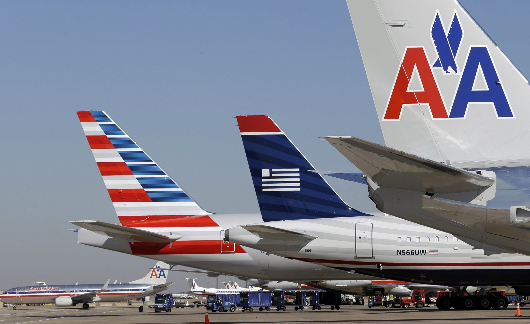 US Airways and American Airlines aircraft line up. 