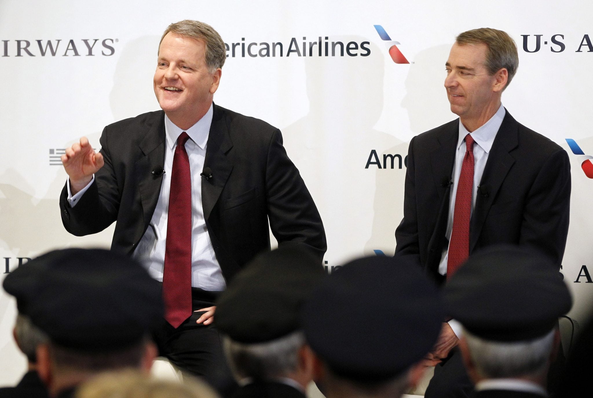 US Airways CEO Parker and American Airlines Chairman, President and CEO Horton announce the planned merger of American Airlines and US Airways during a news conference at Dallas-Ft Worth International Airport. 