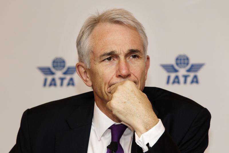 IATA director general Tony Tyler listens to a question at a news conference in Beijing. 