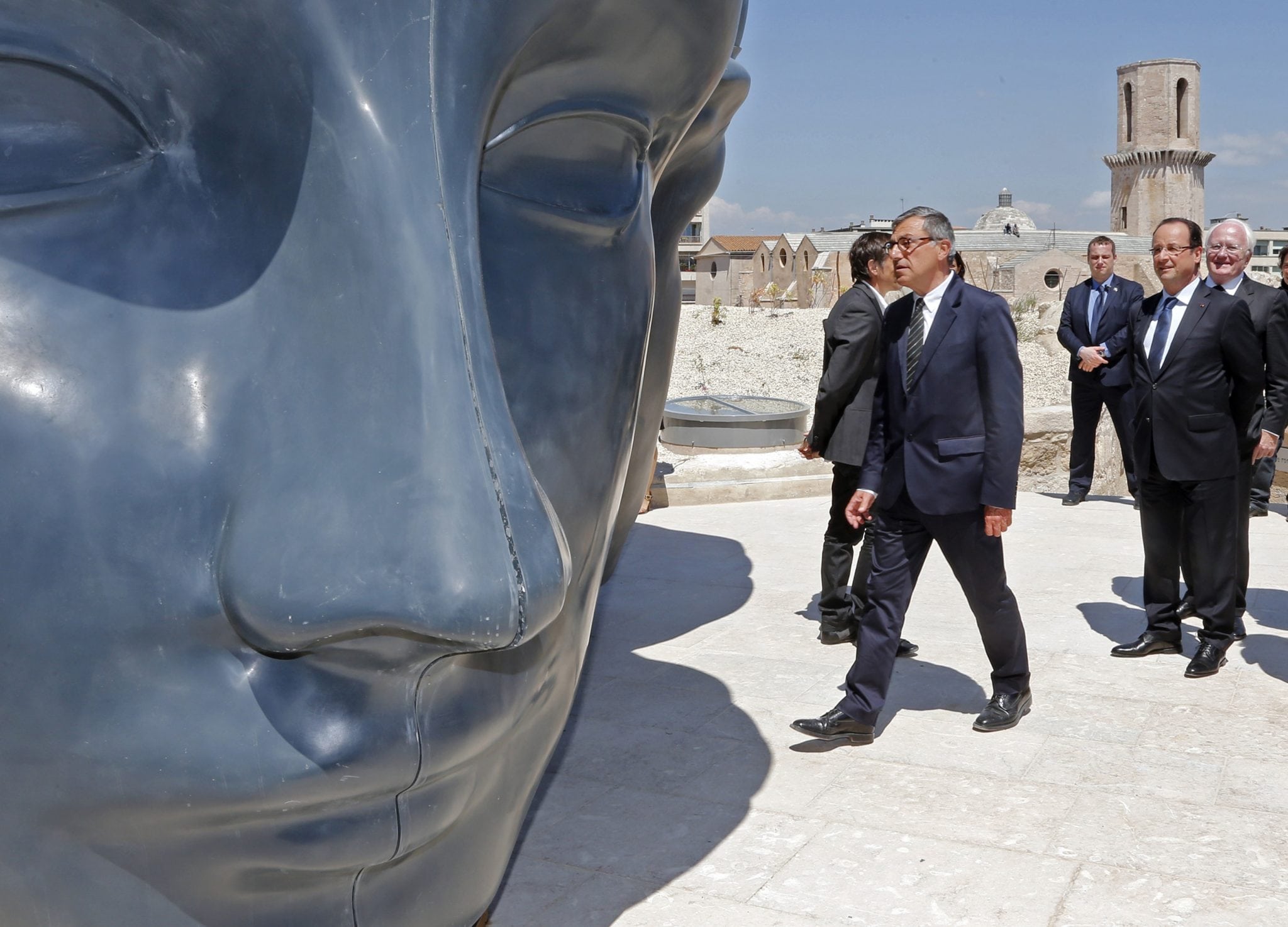 French President Francois Hollande, right, with MuCEM president Suzzarelli, center, seen during his visit to the Museum of Civilizations from Europe and the Mediterranean (MuCEM) in Marseille, southern France, Tuesday June 4, 2013. 