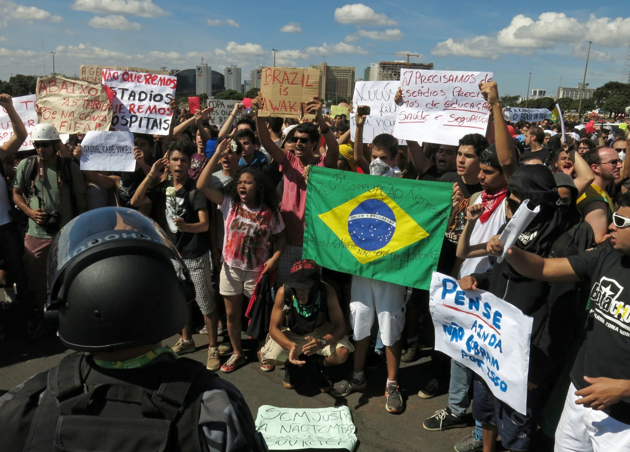 Protesters rally before Confederations Cup opener. 