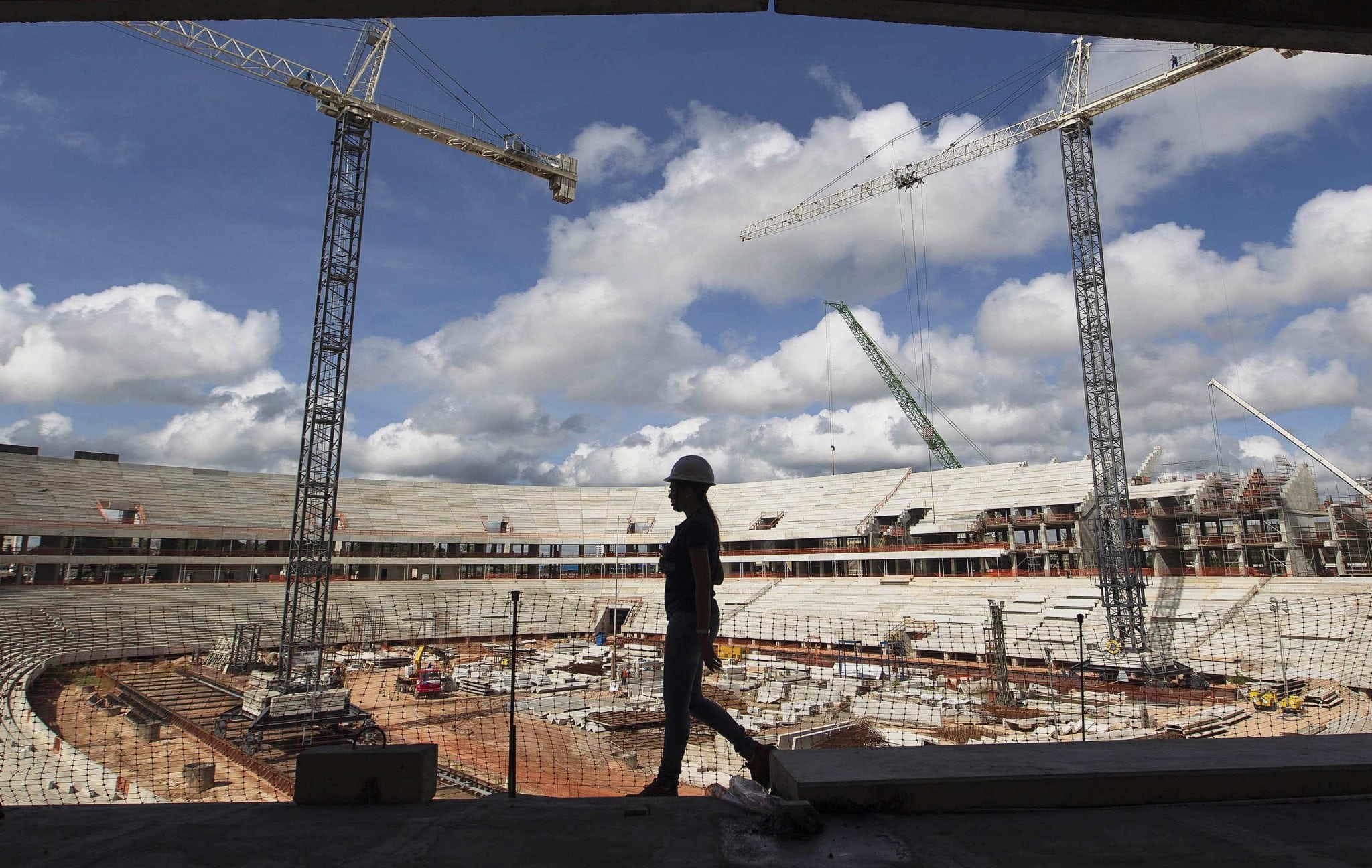 A worker walks inside the Arena da Amazonia, or Vivaldo Lima Stadium, as it is being rebuilt in Manaus. 