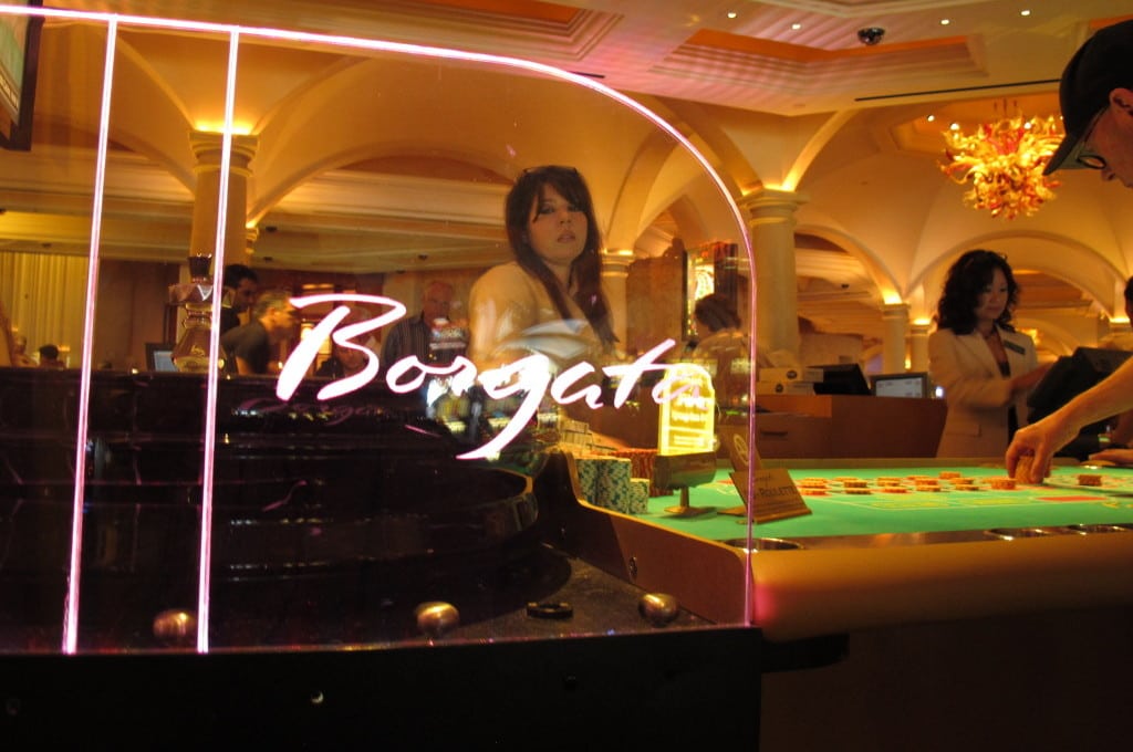 In this June 6, 2013, photo, a dealer waits as a gambler places chips on a roulette table at the Borgata Hotel Casino & Spa in Atlantic City N.J. The Borgata has its 10th anniversary on July 2, 2013. 