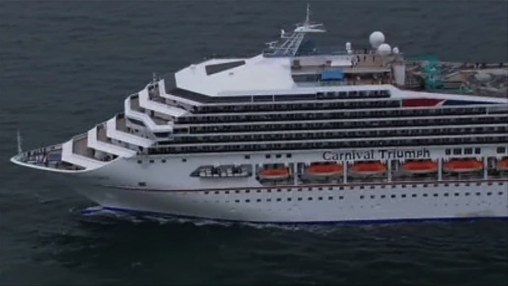 The cruise ship Carnival Triumph is towed off the coast of Alabama. 