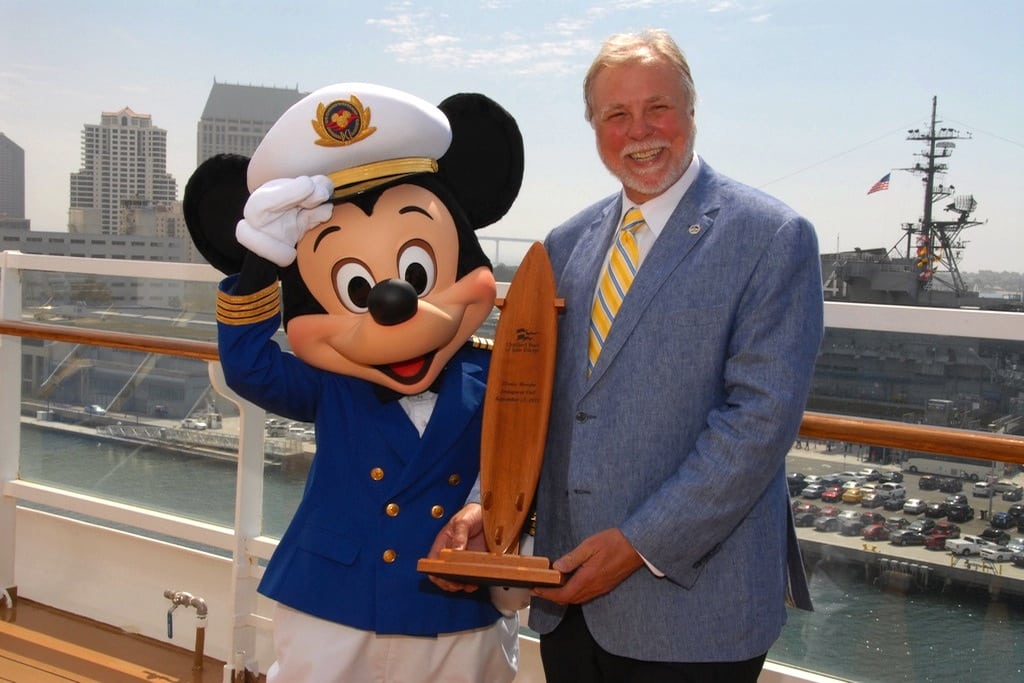 "Captain Mickey" receives a ceremonial plaque presented by Port of San Diego Commissioner Bob Nelson aboard the Disney Wonder.