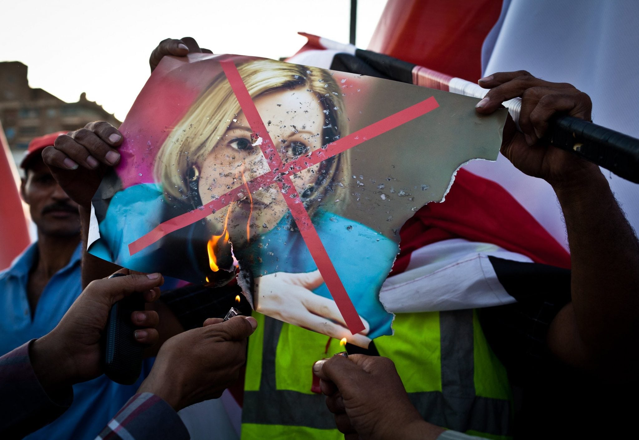 A photograph of U.S. Ambassador to Egypt Anne Patterson is burned outside the Ministry of Defense in Cairo, Egypt, on Friday, June 28, 2013.