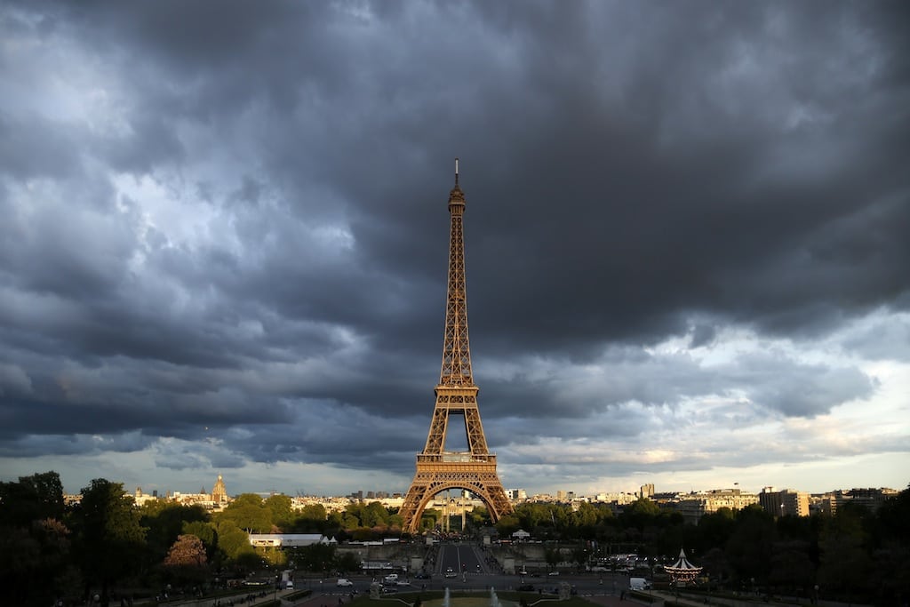 The Eiffel Tower is seen under clouds in Paris May 28, 2013. 