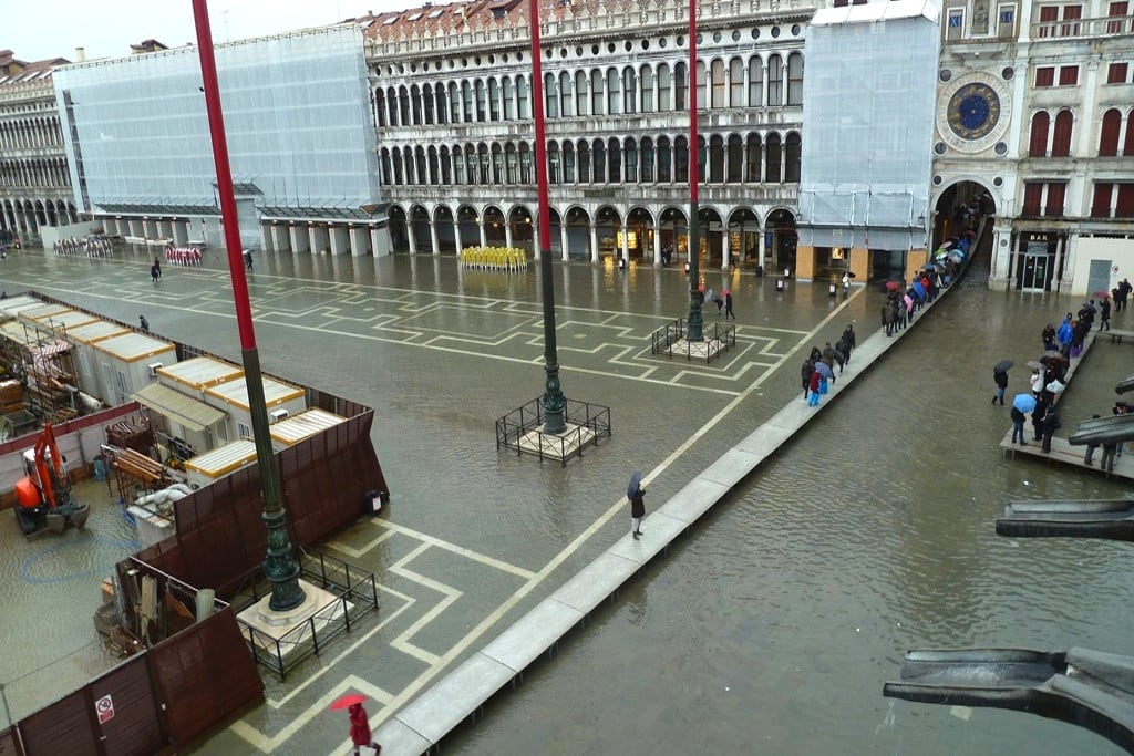 Walkways are set up for tourists when floods take over Venice. 