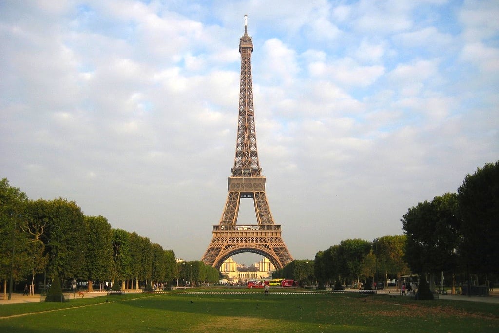 An empty lawn in front of the Eiffel Tower. 