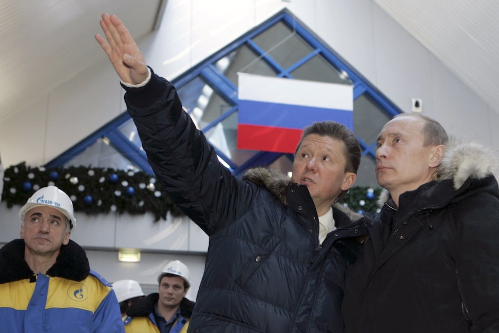 In this Wednesday, Jan, 2, 2008 file photo Russian President Vladimir Putin, right, listens to the state-controlled natural gas monopoly Gazprom CEO Alexei Miller as they tour the newly opened alpine ski center that will be used in the 2014 Olympics at Krasnaya Polyana in the southern Russian Black Sea resort of Sochi.