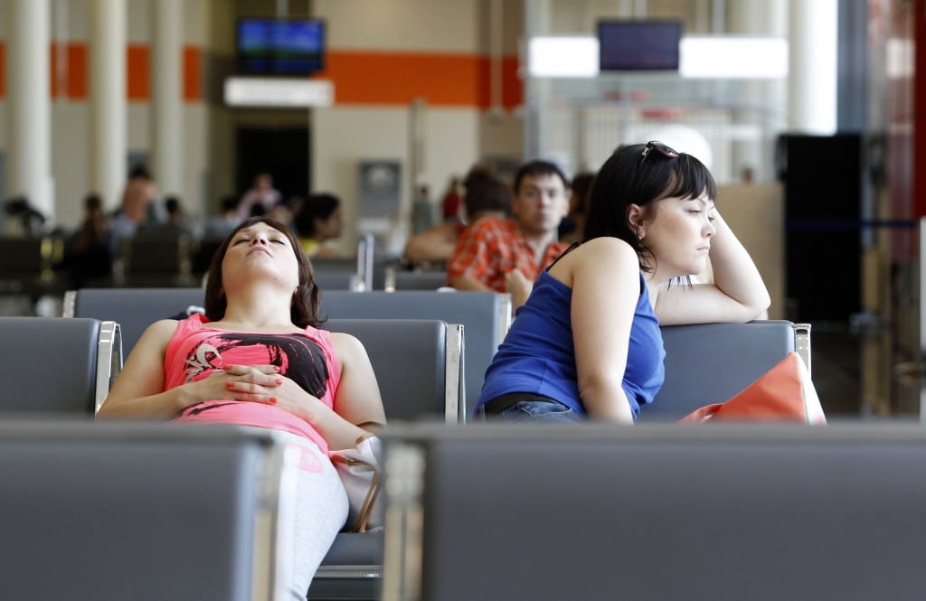 People sit in a waiting room at Moscow's Sheremetyevo airport June 26, 2013.