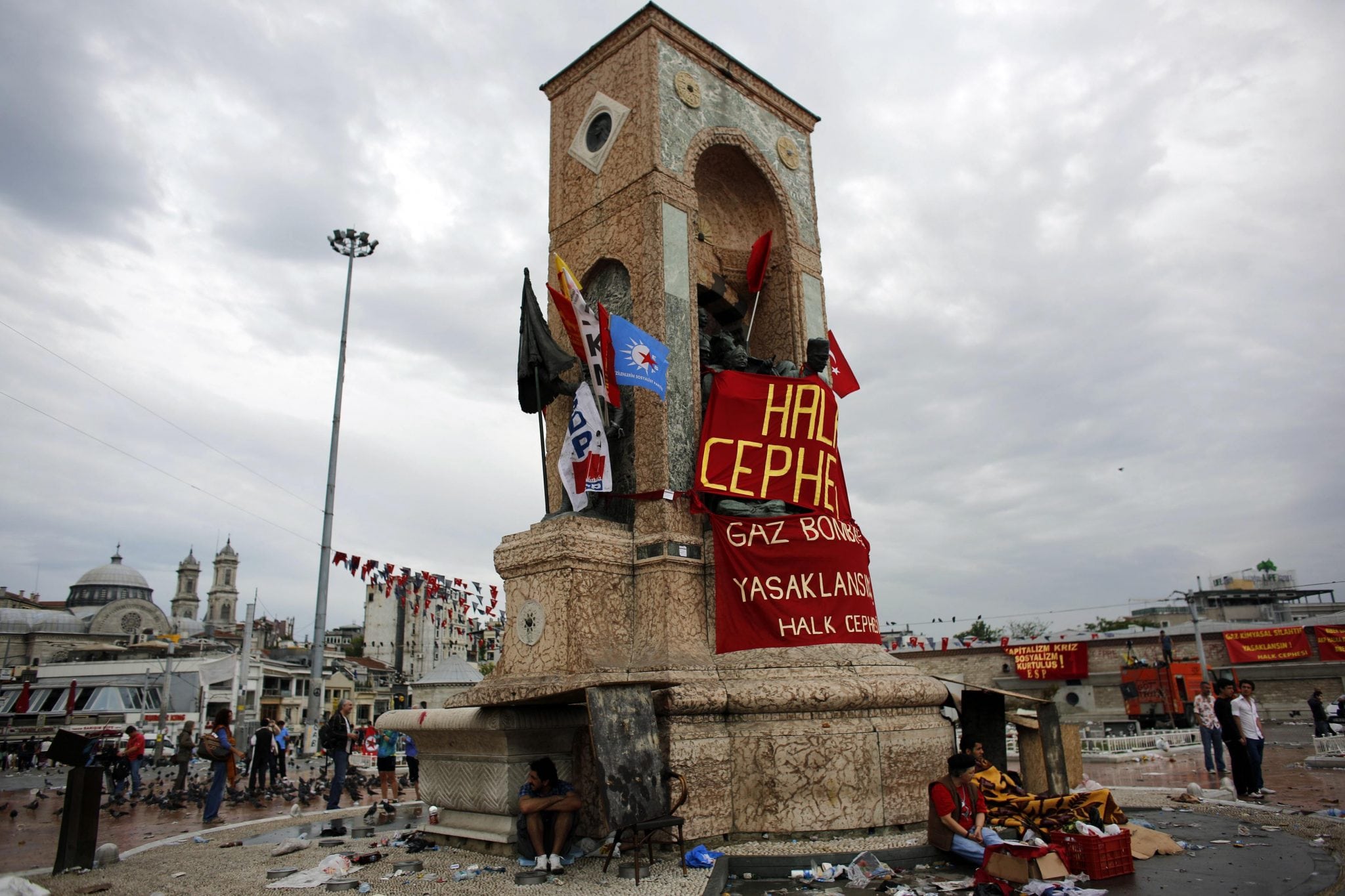 Demonstrators rest in Taksim Square where police and anti-government protesters clashed in central Istanbul June 2, 2013.