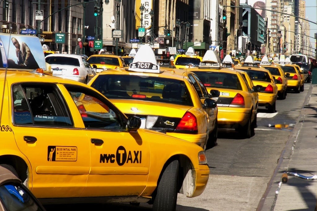 Yellow taxis line up outside New York Cit's Penn Station. 