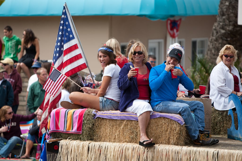 A float in the July 4th Parade in Cayucos, California passes by onlookers.