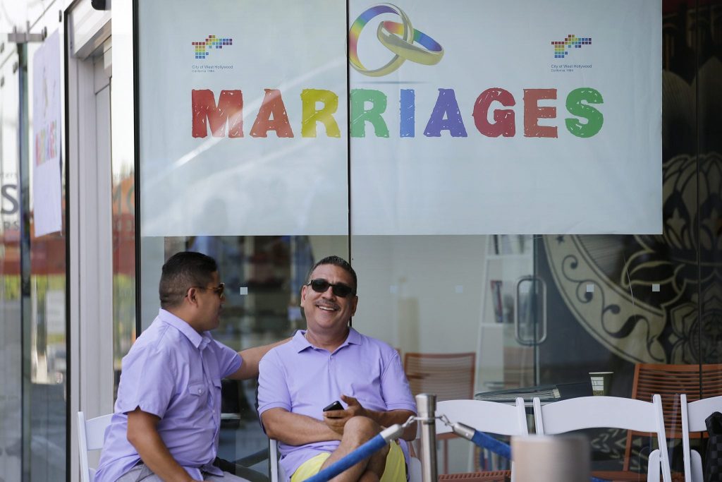 Jose Guerrero, left, and Patrick Rodriguez chat before their wedding ceremony in West Hollywood, California on July 1, 2013. Travel advisors need to know where it is safe to travel for their LGBTQ clients.