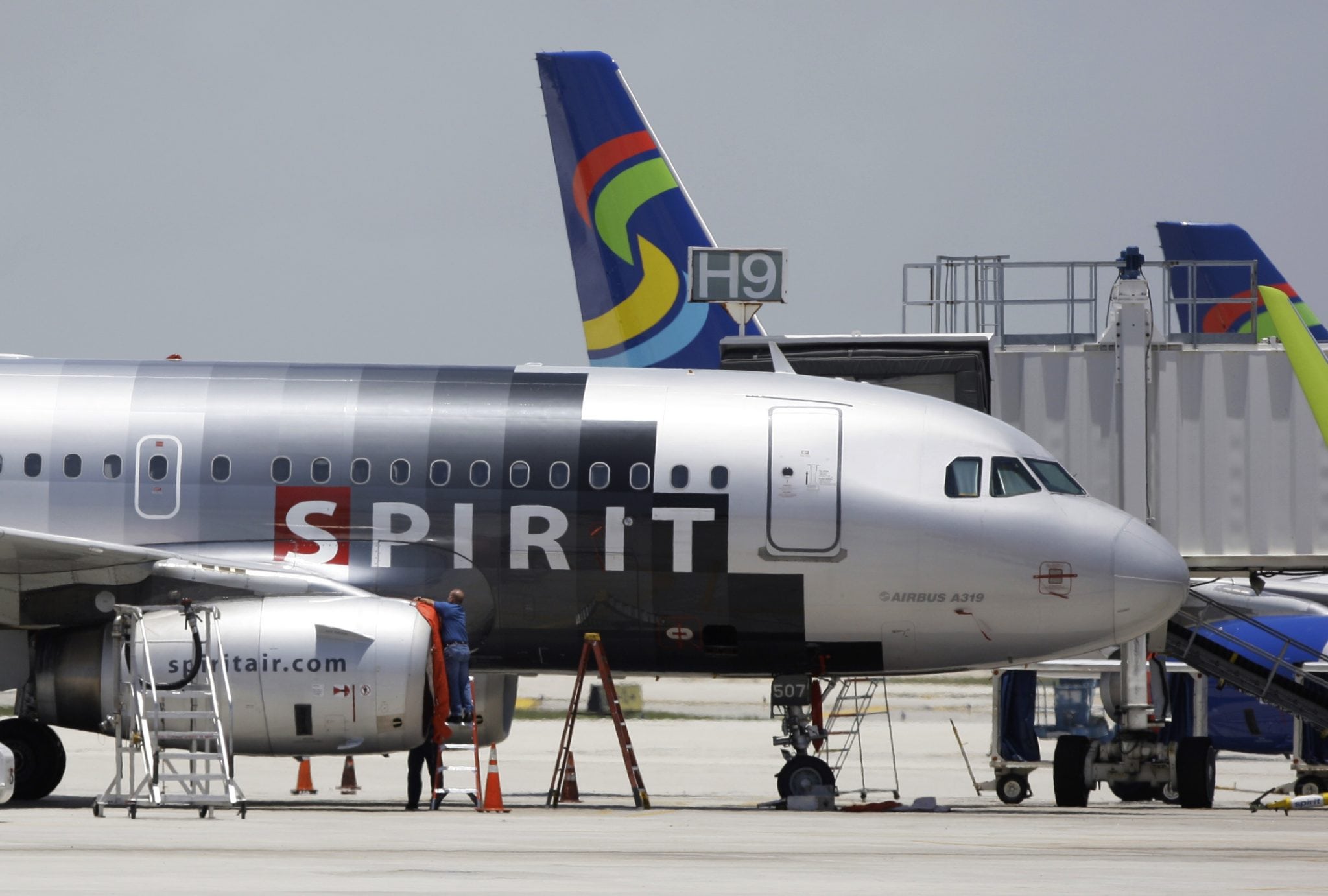 A Spirit Airlines airplane sits on the tarmac at Fort Lauderdale-Hollywood International Airport in Fort Lauderdale, Fla. 