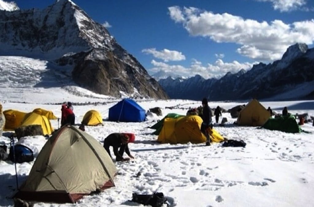 Pitching tents at a snow camp at an elevation of more than 16,000 feet near Leh, India, while enroute to Kang La Pass.
