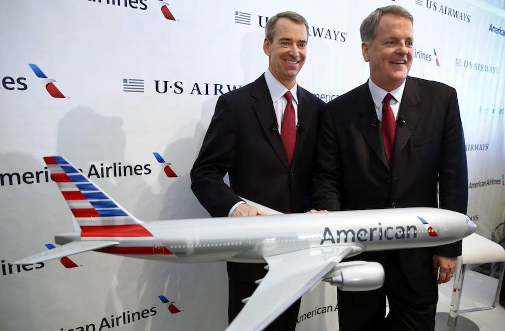 American Airlines CEO Tom Horton, left, and US Airways CEO Doug Parker at a press conference announcing the two airlines' merger on February 14, 2013 in Texas. 
