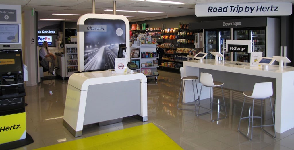 iPads, battery-recharging stations, and a store to purchase everything from snacks and drinks to luggage, are part of the next-generation car-rental facility that Hertz is now in the process of introducing at facilities worldwide.