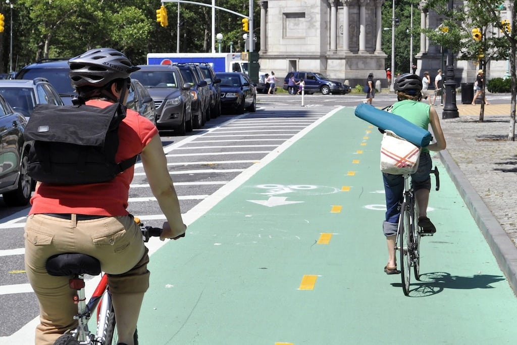 Bikers head towards Washington Square Park in New York City.