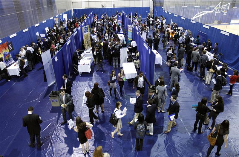 American University students walk among recruiting booths during a career job fair at American University in Washington.