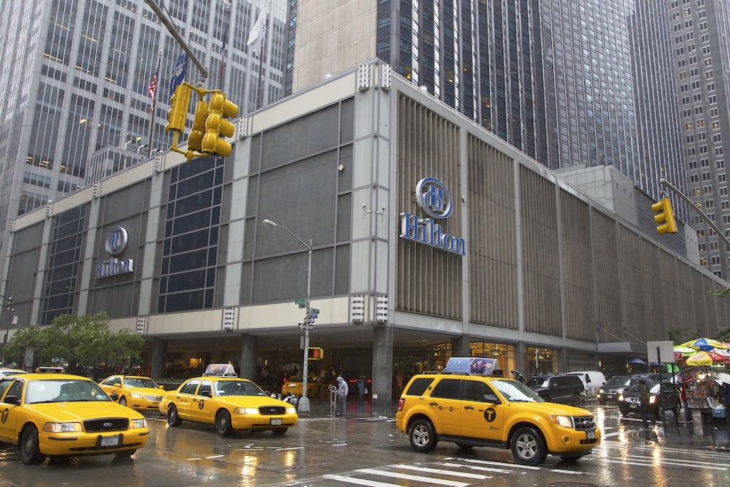 An exterior shot of the Hilton Midtown in New York June 7, 2013. Expedia now gives travelers the choice to prepay for a room through Expedia or pay at the hotel. 