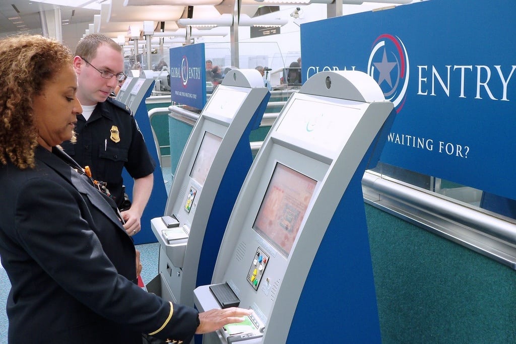 A flyer checks in at a global entry kiosk.