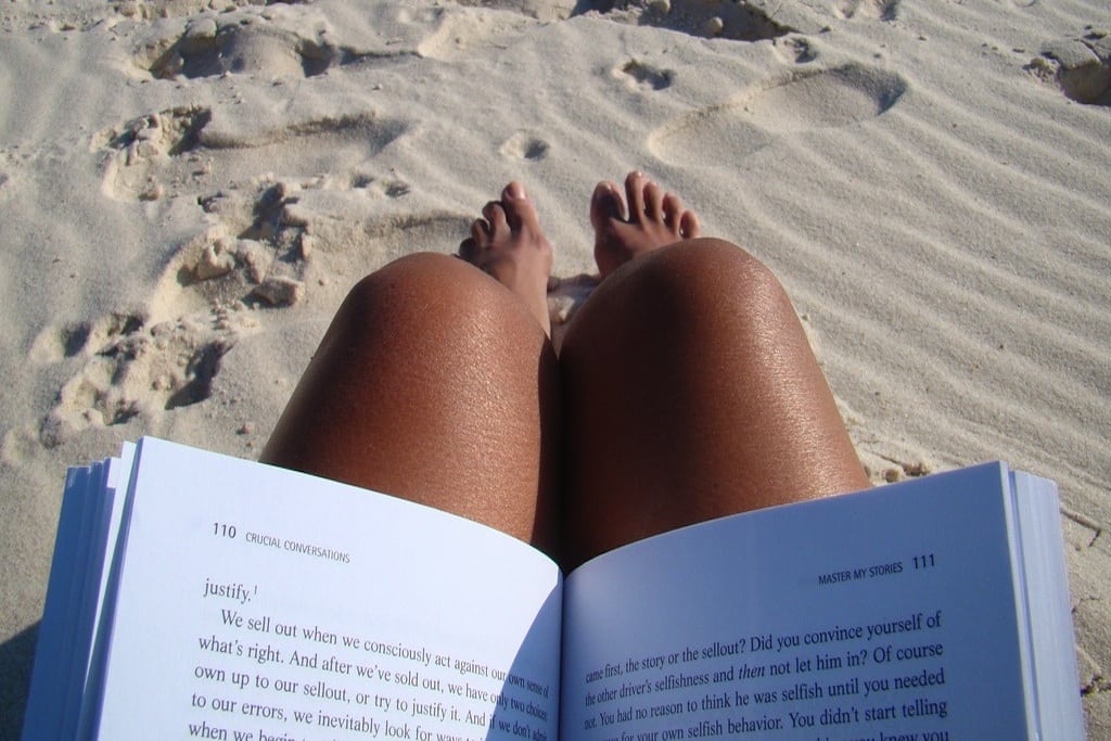 A girl read on the beach near Fort Morgan, Alabama. 