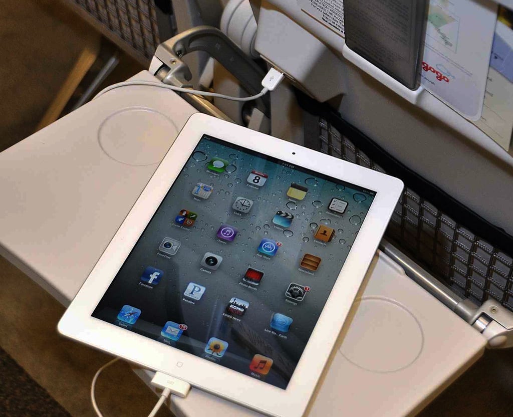 An iPad charging on an Alaska Airlines flight. 