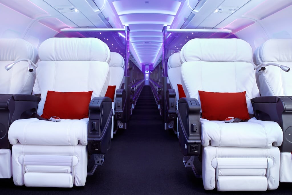 Virgin America's first-class cabin features mood lighting and plush white leather seats. 