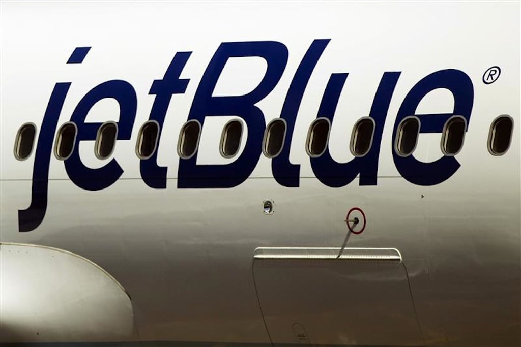 A JetBlue Airways plane awaits take off while at LaGuardia Airport in New York April 5, 2012. 