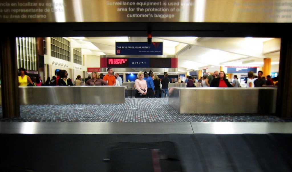 Passengers await their luggage at Hartsfield-Jackson International Airport in Atlanta. 
