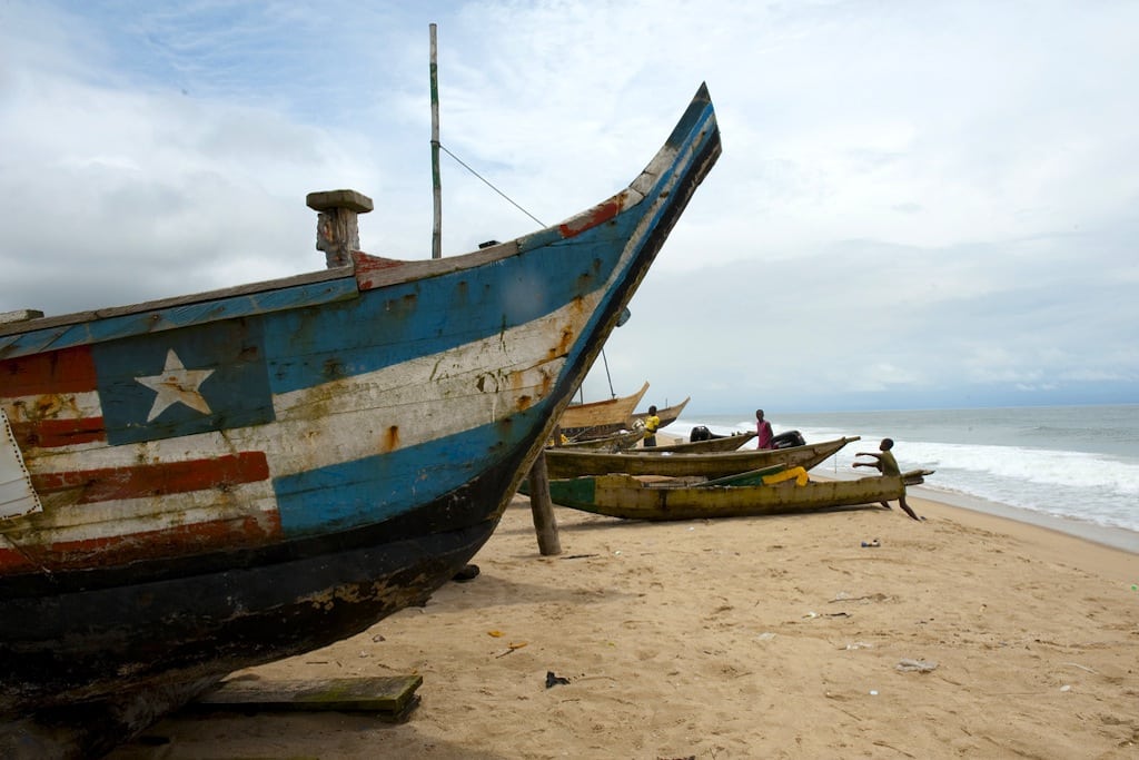 Fishing boats sit on the shore of the Nigerian fishing village Orimedu. 