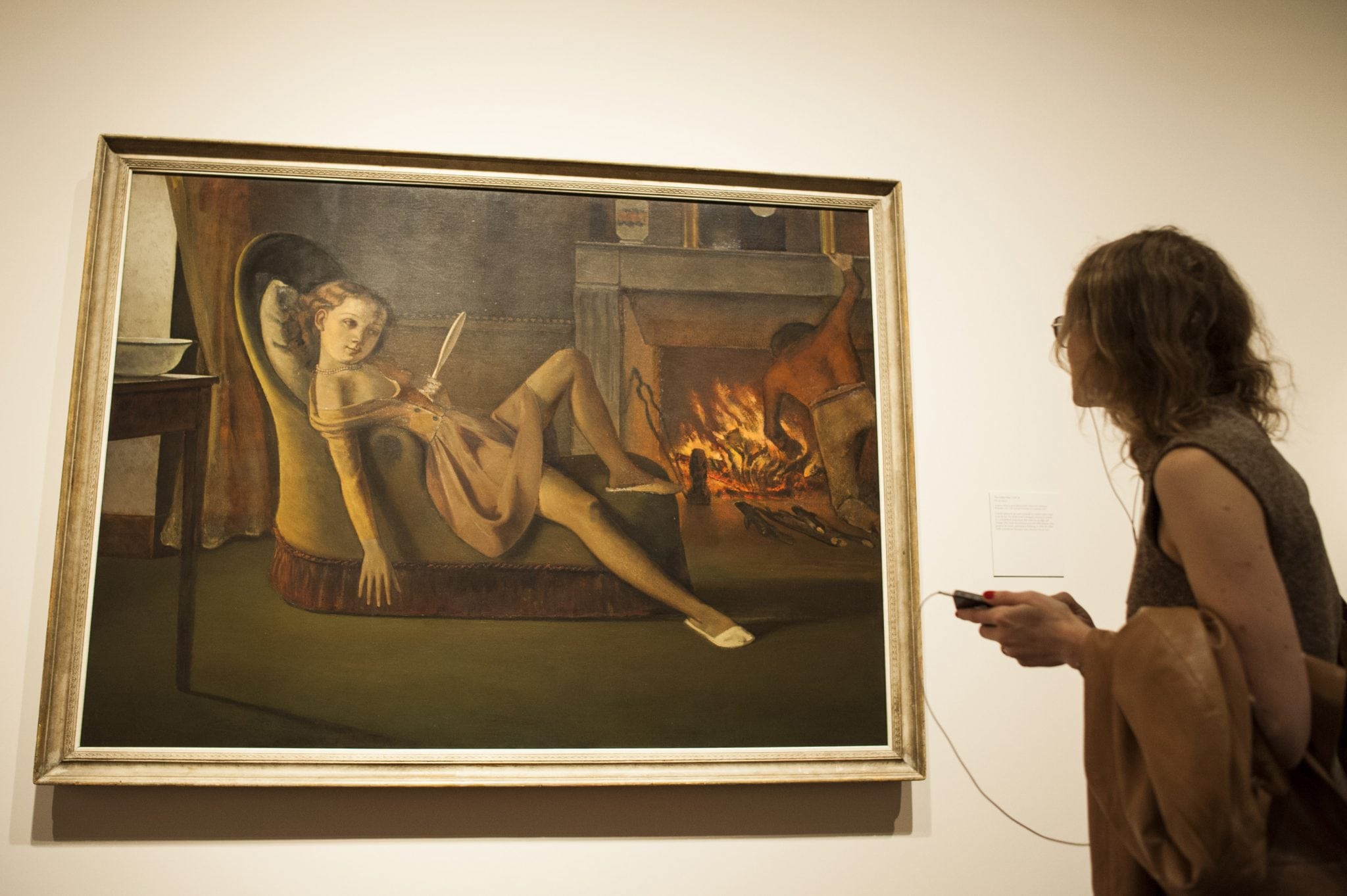 A woman looks at the painting entitled "The Golden Days" by French artist Balthus at the Metropolitan Museum of Art's exhibition in New York. 