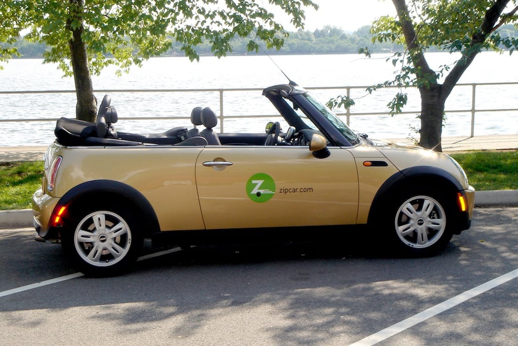 There are now Zipcar pods within Avis locations at 20 airports. Pictured is a Zipcar MINI Cooper convertible. 
