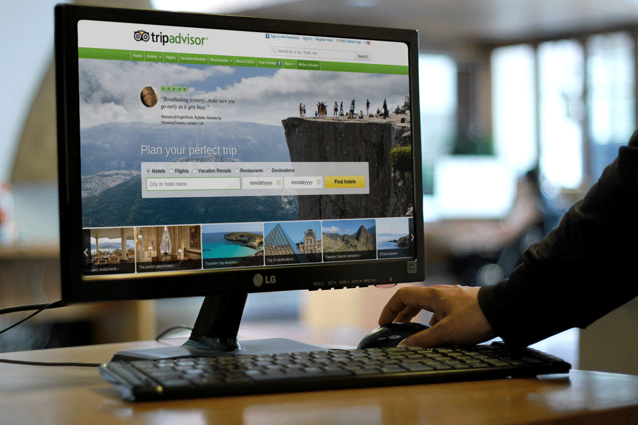 TripAdvisor's website redesign, unveiled in late 2013, is seen on the computer screen above.